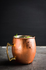Fresh lychee moscow mule on the rustic background. Selective focus. Shallow depth of field.
