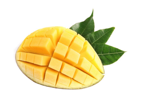 Cut ripe mango on white background. Tropical fruit