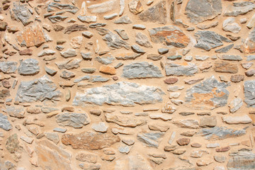 Fototapety  Tekstura kamiennego muru. Stary zamek kamienny mur tekstura tło. Tekstury kamienia i ściany Briks. Grecki stary mur zamku.