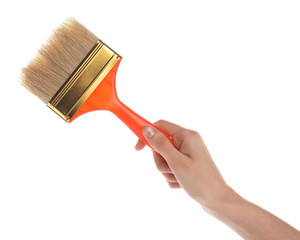 Woman holding paint brush on white background, closeup