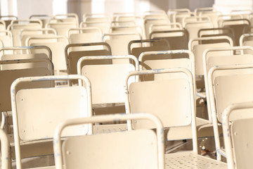 Fototapeta premium Rows of white chairs outdoor