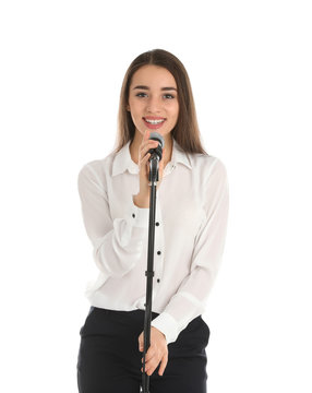 Young stylish woman with microphone on white background