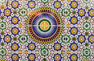 Old wall decorated with beautiful mosaics in Marrakech, Morocco