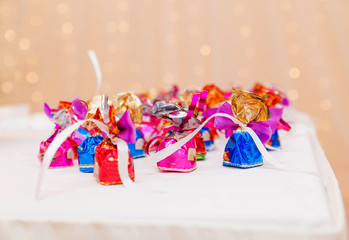 sweets on the table on a background of shiny lights