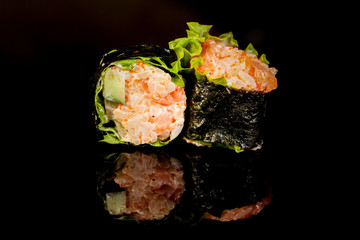 Japanese national popular cuisine. Sushi, rice and fish. Tasty, beautifully served food in a restaurant, cafe, with elements of the original design