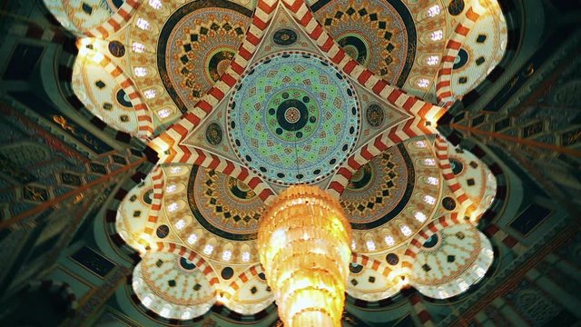 The roof of the mosque is decorated with beautiful chandeliers