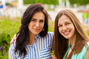 Closeup portrait of a happy young women smiling