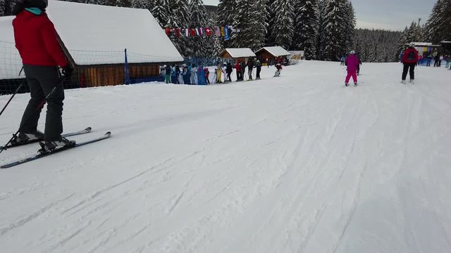 ROGLA, SLOVENIA, 2019.01.29: People skiing and going up the ski lift. Filming beautiful ski resort on cold sunny winter day.