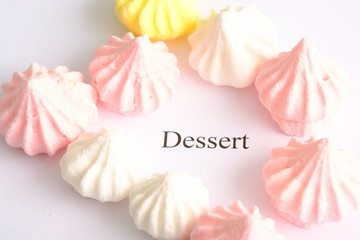 sweet cakes dessert of different colors on a white background