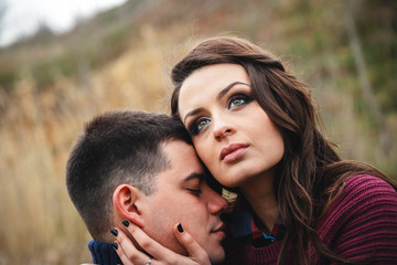 Close up of romantic attractive young couple hugging outdoors
