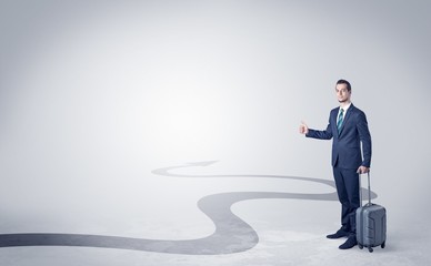 Fototapeta premium Young businessman hitchhiking with progressive arrow concept and copyspace 