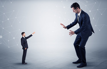 Small businessman aiming at a big businessman with connection and network concept
