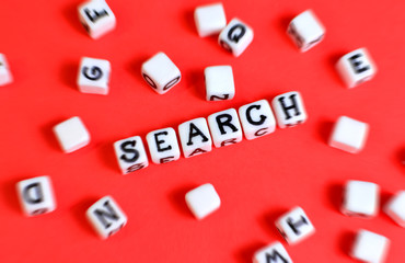 Search concept with cubes "Search" word and other defocused cubes