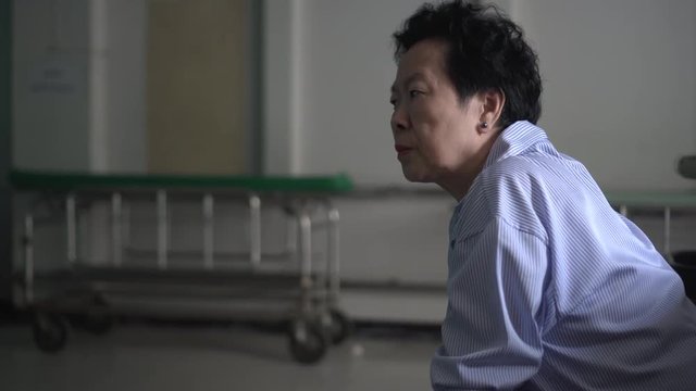 Asian elderly woman sad worry at hospital
