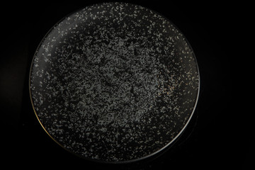 top view on round grey textured restaurant plate