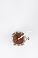 Protein shake, smoothie with chocolate and cocoa in a jar on a white background