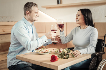 Imposing man enjoying dinner with charming woman