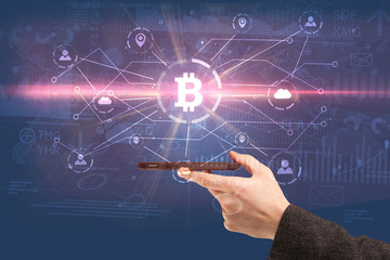 Hand using phone with cryptocurrency bitcoin link network and online concept

