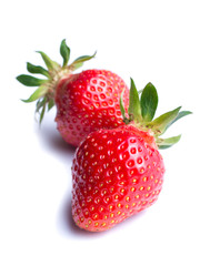 Two ripe strawberries isolated on white background