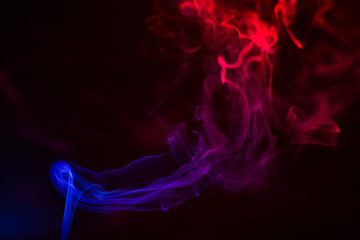 Colorful smoke close-up on a black background