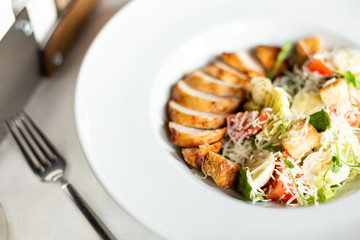 Romain salad with grilled chicken, garlic croutons and parmesan