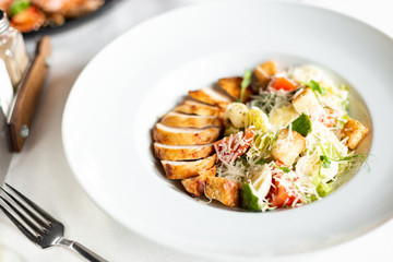 Romain salad with grilled chicken, garlic croutons and parmesan