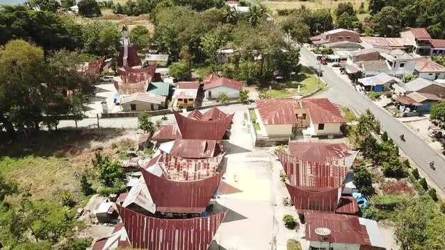 Drone flying over traditional Batak Village on Samosir Island in Lake Toba. Sumatra, Indonesia.