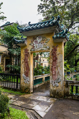 Fototapeta na wymiar July 2017 – Kaiping, China - Carved Arch in Li garden Kaiping Diaolou complex, near Guangzhou. Built by rich overseas Chinese, these family houses are a unique mix of Chinese and western architecture
