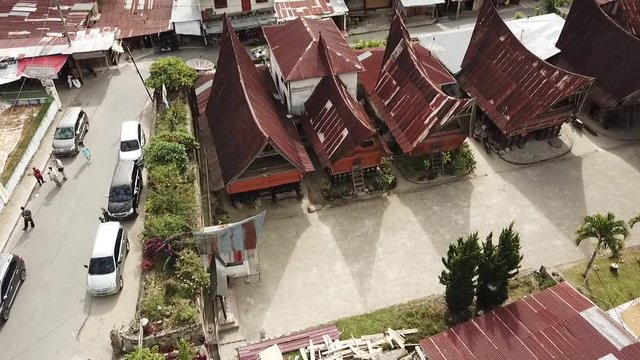Drone making a circle of the traditional Batak village on Samosir Island in lake Toba, Sumatra, Indonesia.