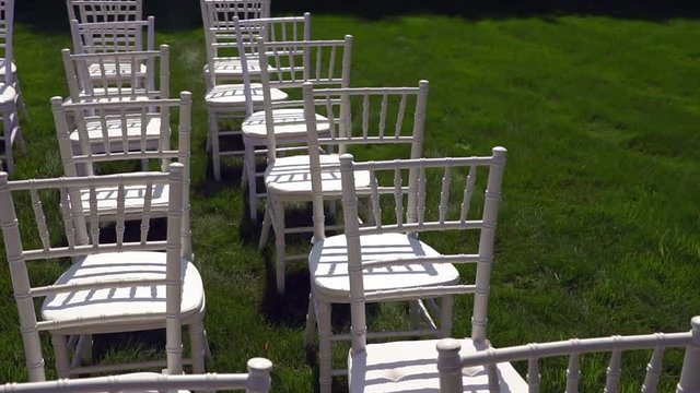 Chiavari chairs are displayed on the lawn.