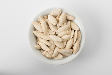 Dried White Pumpkin Seeds in a Bowl