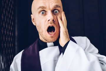 Priest confessives in the confessional