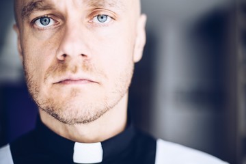 Catholic priest in church.