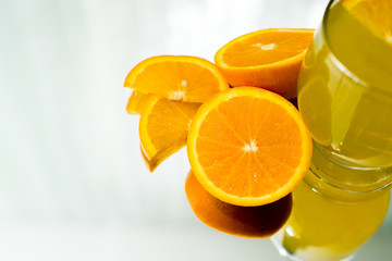 Orange and orange Juice on table.