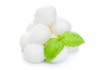 Fresh Mozzarella cheese and basil leaf on white background.