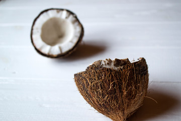 Coconut on a white wooden background.