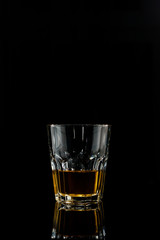 wiskey glass on dark background
