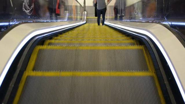 Escalator in motion, close up point of view, reversible and loopable