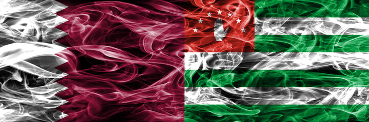 Qatar vs Abkhazia, Abkhazian smoke flags placed side by side. United Arab Emirates. UAE.