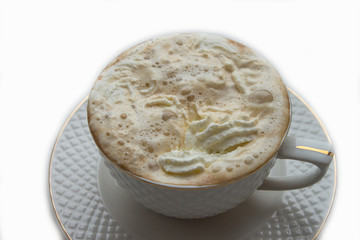 white cup with hot coffee and whipped cream on a white background.