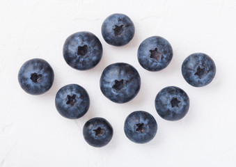 Fresh raw organic blueberries on white background. Macro close up