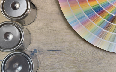  Palette color and paint can on wood background