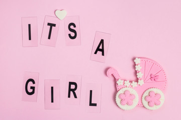 It's a girl pink card. Newborn background. Baby shower invitation. Birth announcement. Flat lay