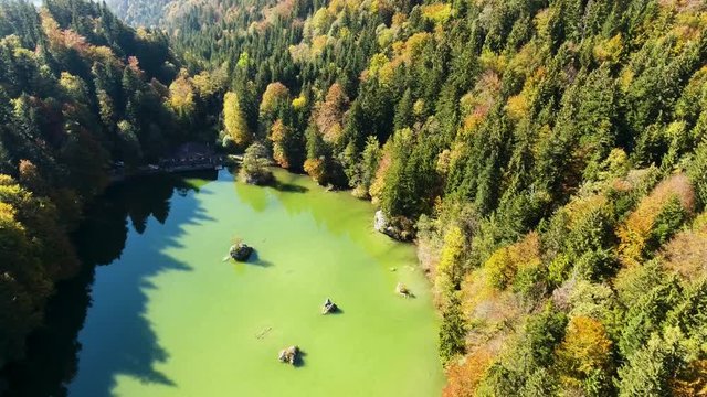 AERIAL - Lake Berglsteiner, a beautiful lake with green color in the TIroler Alps with the DJI Phantom 4.