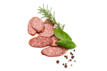Dried salami slices with herbs, top view, isolated on white background