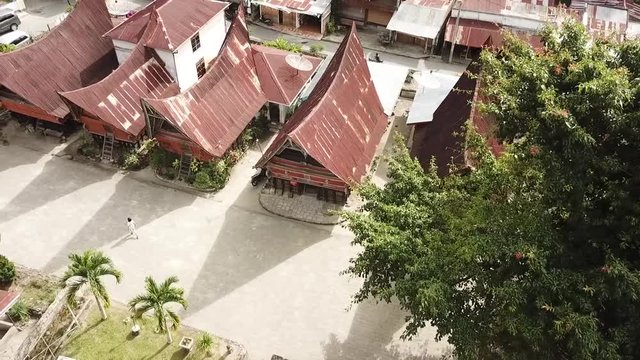 Drone flying over traditional Batak village in Samosir Island, Lake Toba, Sumatra, Indonesia.
