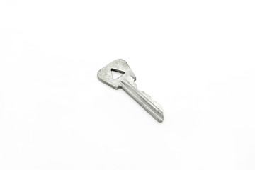Old key with a triangular hole on white background