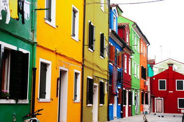 Fototapeta na wymiar Venetian island district of colorful houses in Italy