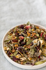 spring detox concept.  Herbal tea in white ceramic plate