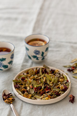 spring detox concept.  Herbal tea in white ceramic plate